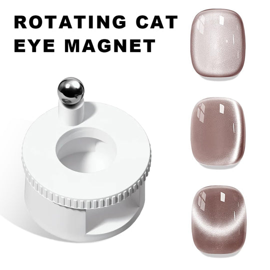 Rotating cat's eye magnet nail tool with white cylindrical body, silver magnetic ball top, and three nail examples showing gradient cat eye effects in light pink, mauve, and brown shades on natural nails
